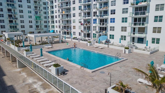 view of swimming pool featuring a gazebo and a patio area