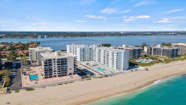 drone / aerial view featuring a view of the beach and a water view