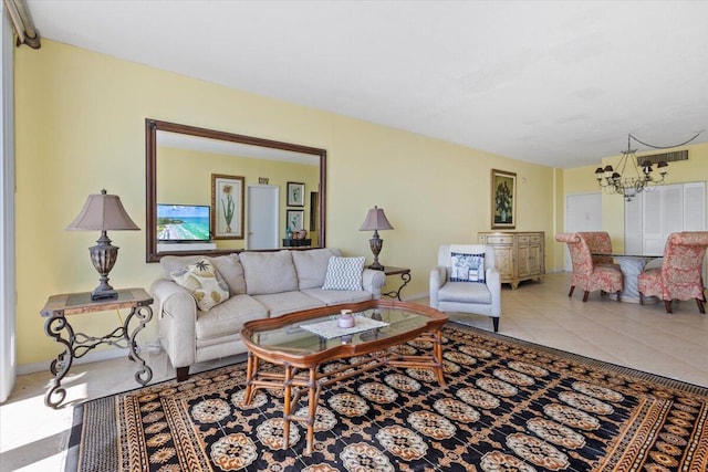 living room featuring tile patterned floors and an inviting chandelier