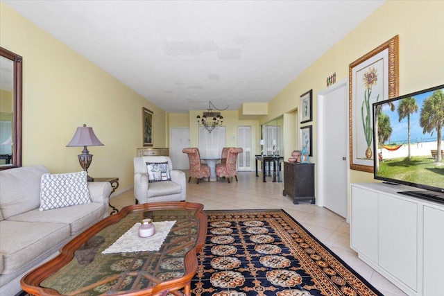 living room with light tile patterned floors and a chandelier