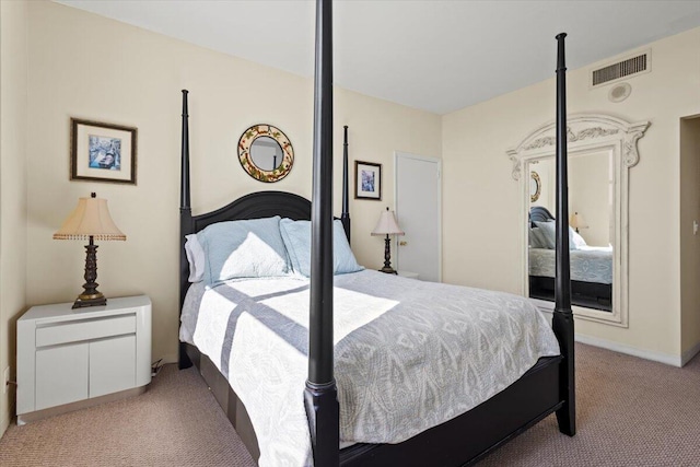 bedroom featuring light colored carpet