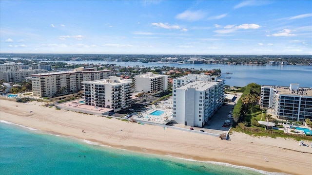 bird's eye view with a view of the beach and a water view