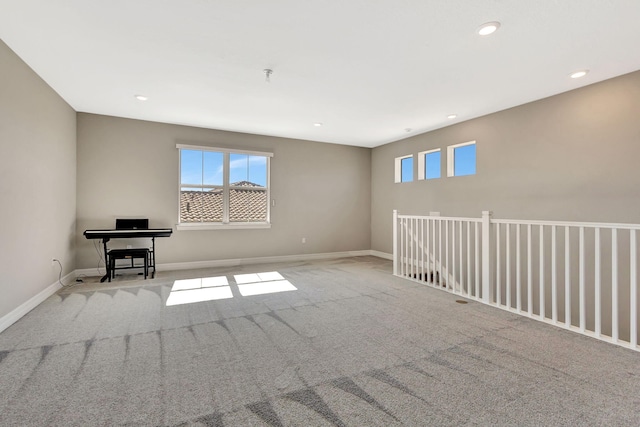 empty room featuring light colored carpet