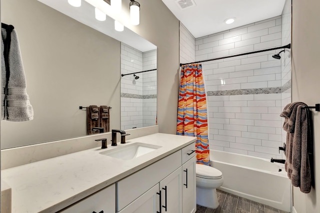 full bathroom featuring shower / bathtub combination with curtain, vanity, and toilet