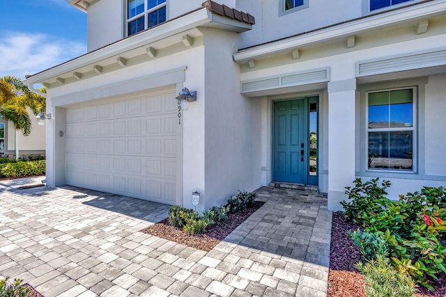 doorway to property featuring a garage