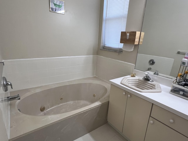 bathroom with vanity and a bath