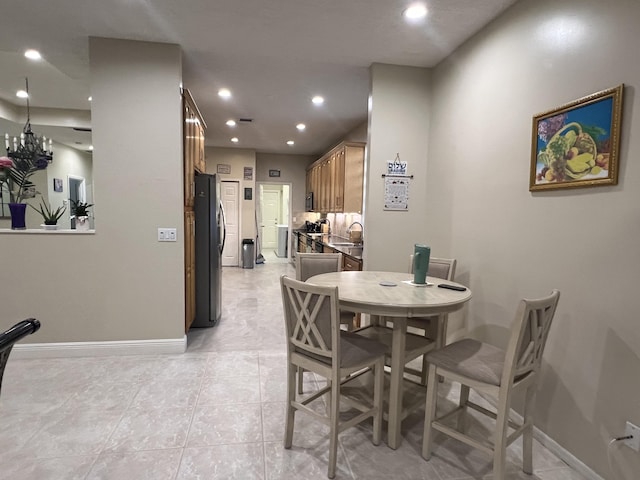 tiled dining area featuring sink