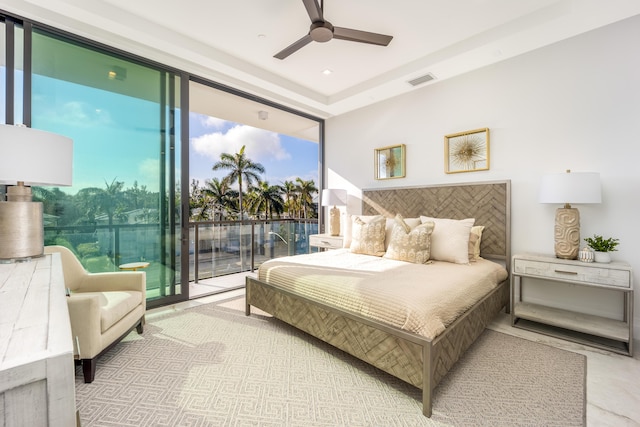 bedroom with ceiling fan and access to exterior