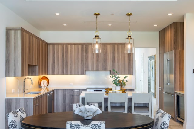 kitchen with sink, decorative backsplash, and hanging light fixtures