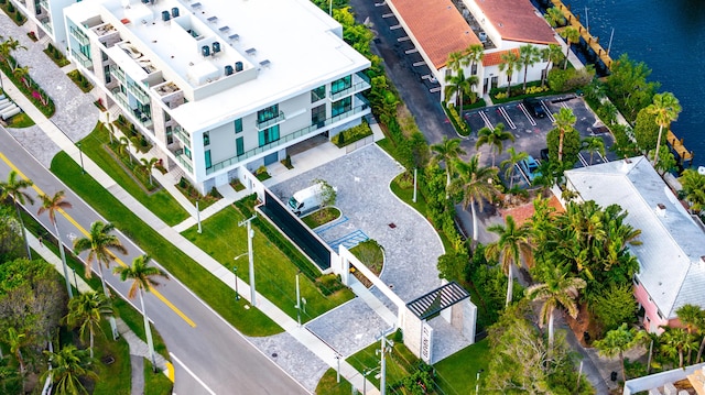 birds eye view of property with a water view