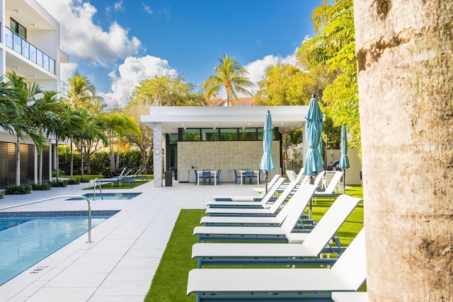 view of swimming pool with a patio