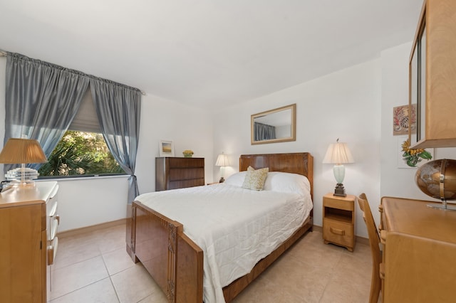 bedroom with light tile patterned flooring