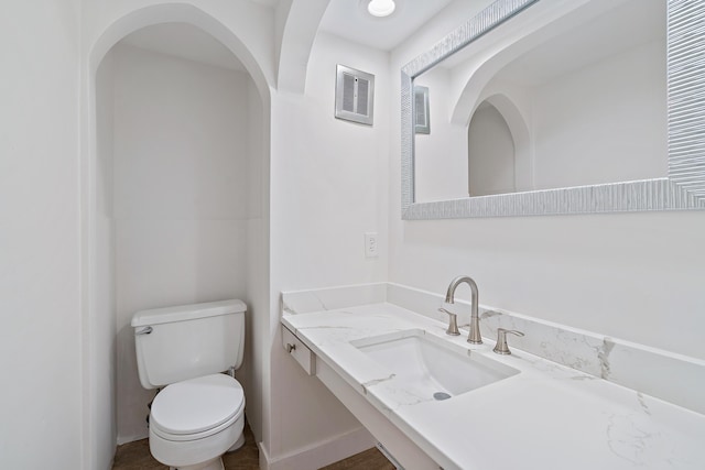 148 Yacht Club Dr Unit 12, North Palm Beach, FL 33408 - bathroom featuring toilet and vanity