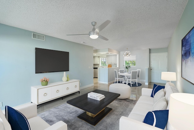 148 Yacht Club Dr Unit 12, North Palm Beach, FL 33408 - living room with a ceiling fan and a textured ceiling