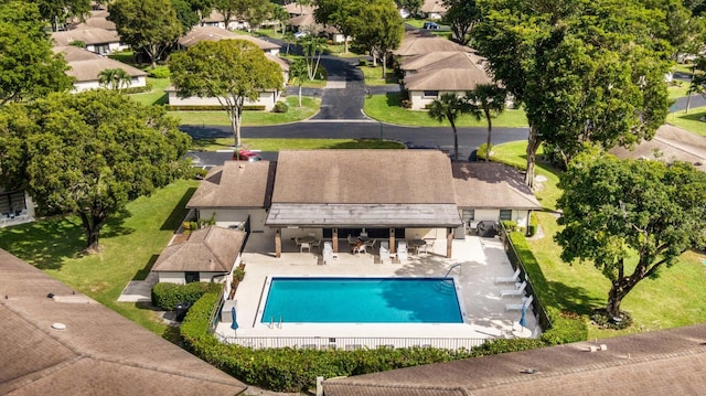 community pool with a patio area