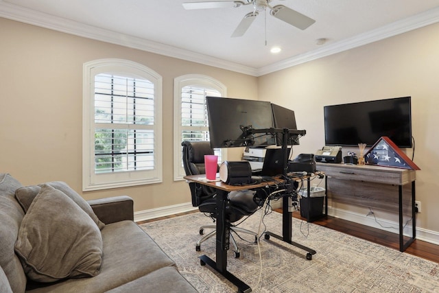 office area with wood-type flooring, ornamental molding, and ceiling fan