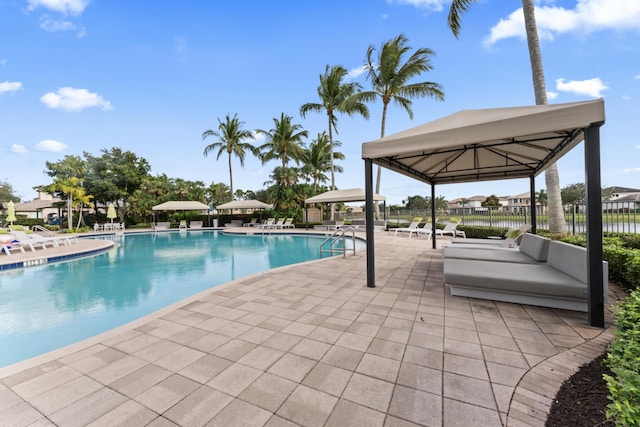 view of swimming pool featuring a gazebo and a patio area