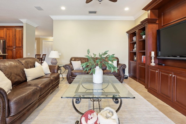 living room featuring ornamental molding, light tile patterned floors, and ceiling fan