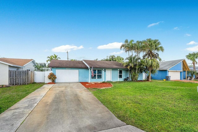 ranch-style home with a garage and a front yard