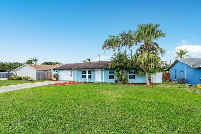 ranch-style house with a garage, central AC unit, and a front lawn