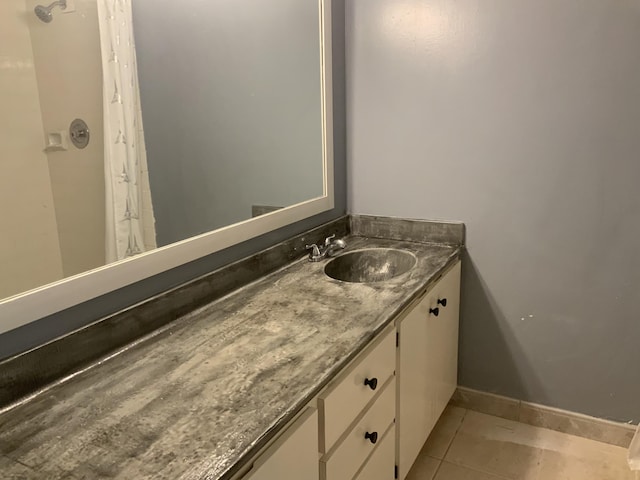 bathroom with vanity and tile patterned floors