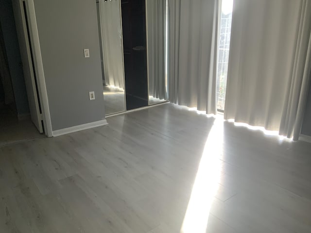 spare room featuring light hardwood / wood-style flooring