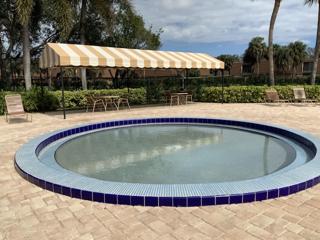 view of pool with a patio area