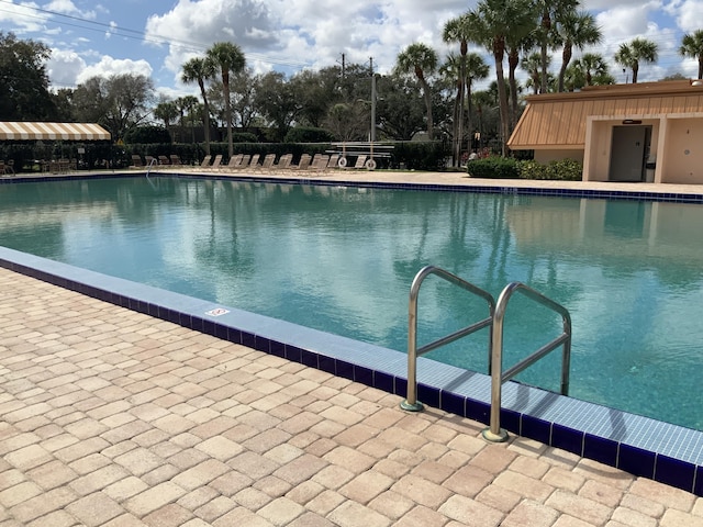 view of pool featuring a patio