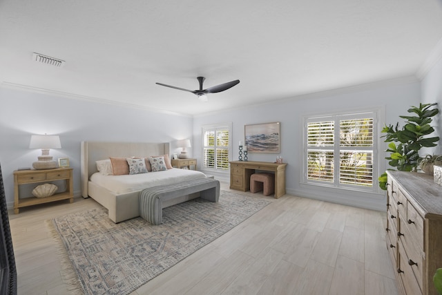 bedroom featuring ceiling fan, ornamental molding, and light hardwood / wood-style floors