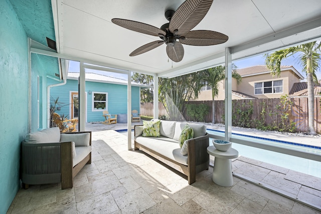 sunroom with ceiling fan