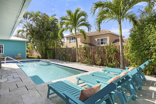 view of swimming pool with a patio