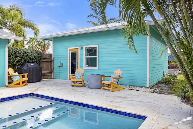 back of property with a patio