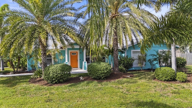 obstructed view of property featuring a front yard