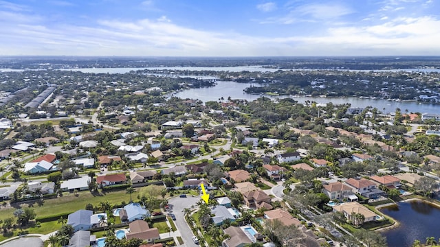 birds eye view of property featuring a water view