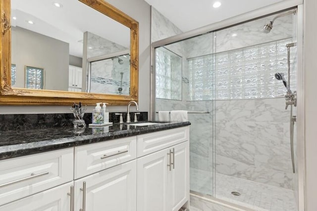 bathroom with vanity and walk in shower