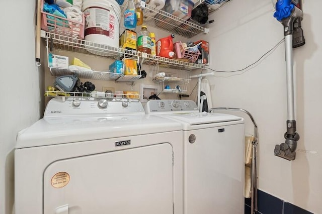 laundry room featuring washing machine and clothes dryer