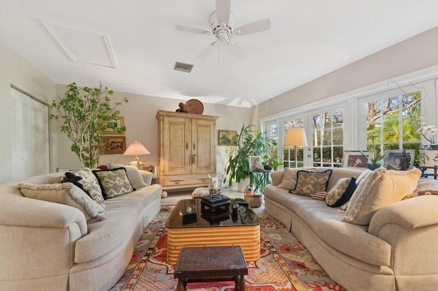 living room featuring french doors and ceiling fan