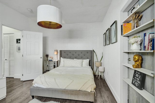 bedroom featuring dark hardwood / wood-style flooring