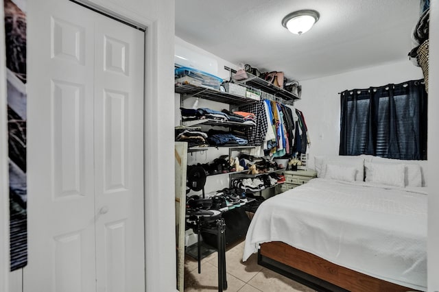 bedroom with light tile patterned floors