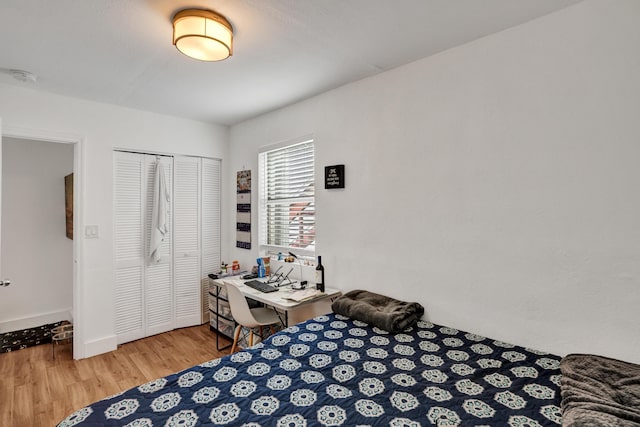 bedroom featuring hardwood / wood-style floors and a closet