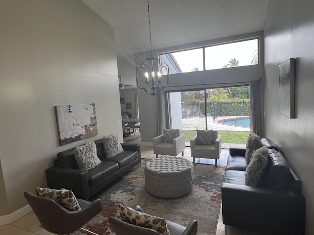 living room with a chandelier and a high ceiling