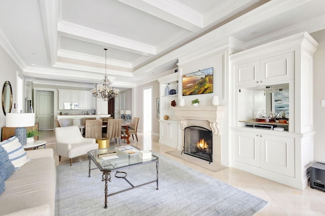 tiled living room with ornamental molding, an inviting chandelier, a high end fireplace, and a tray ceiling