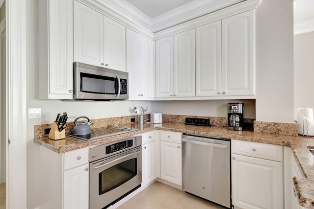 kitchen with light stone counters, light tile patterned floors, ornamental molding, appliances with stainless steel finishes, and white cabinets