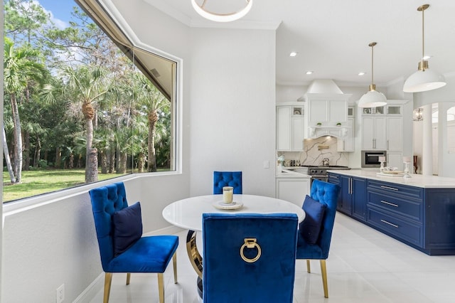 dining room featuring a wealth of natural light and ornamental molding