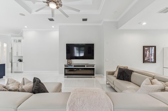 living room with ceiling fan and crown molding