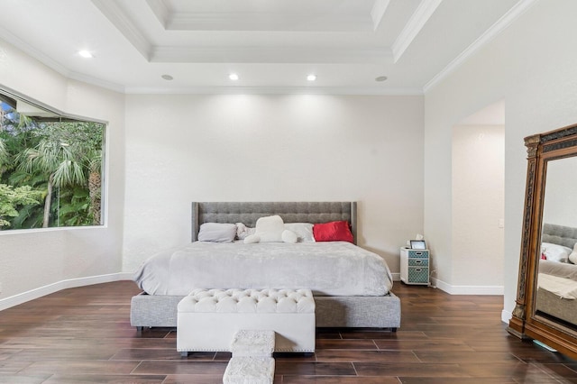 bedroom featuring crown molding, a tray ceiling, and dark wood-type flooring