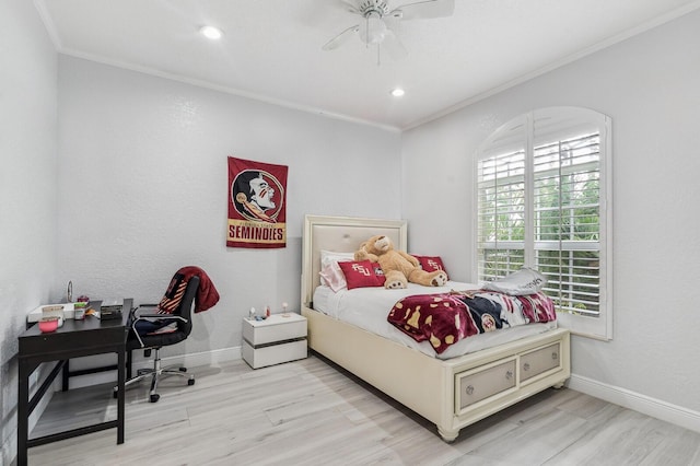 bedroom with light hardwood / wood-style floors, ceiling fan, and ornamental molding