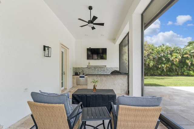 view of patio / terrace featuring ceiling fan