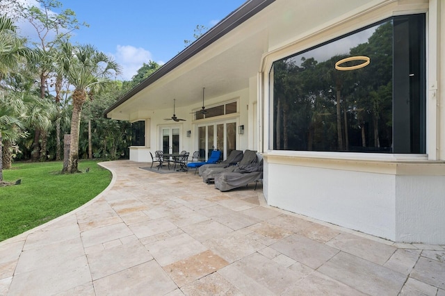 view of patio with french doors and ceiling fan