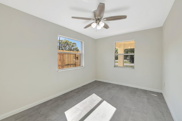 spare room featuring ceiling fan